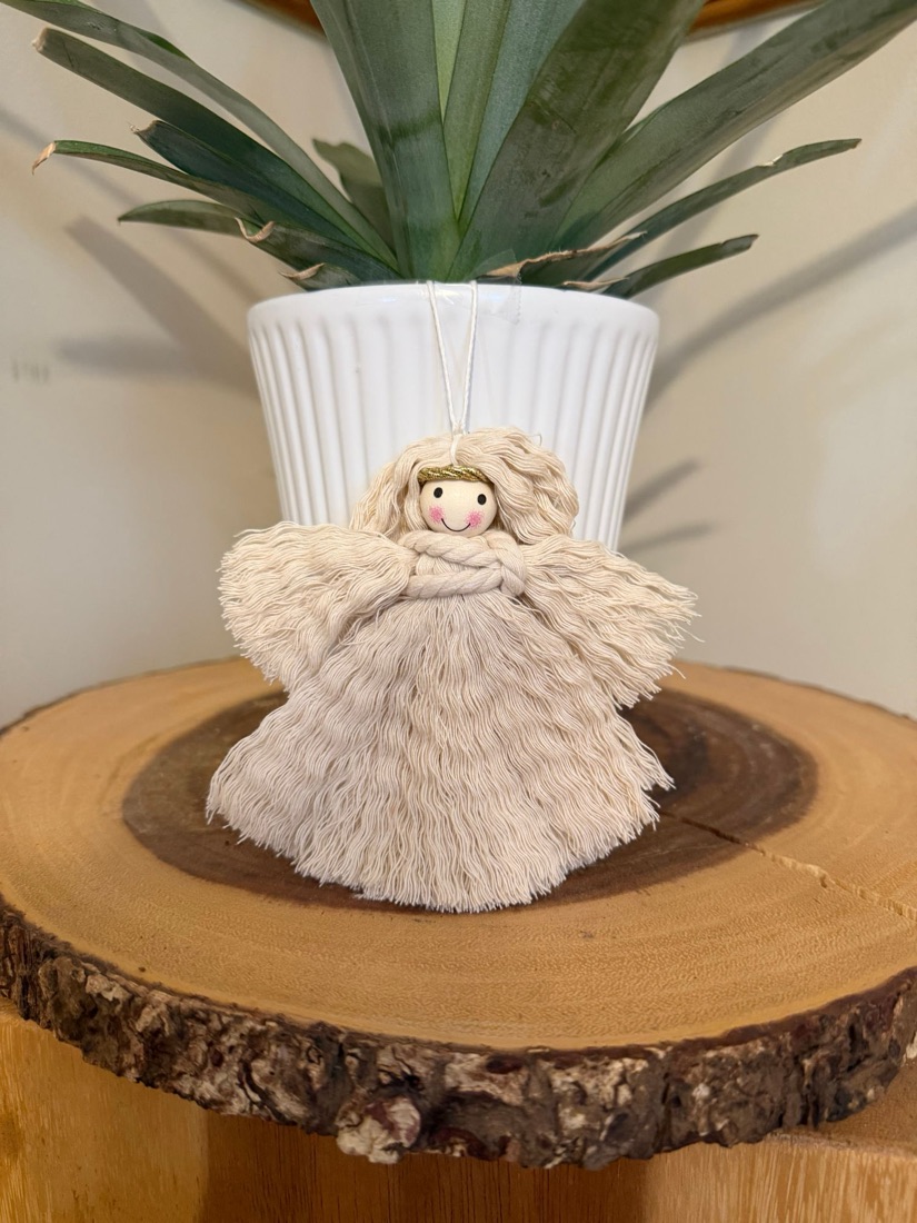 Cream macramé angel ornament with a gold halo and smiling face